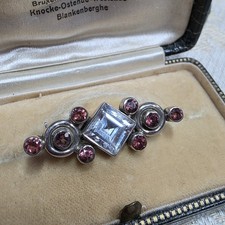 Petite broche col argent - de,