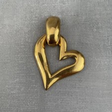 YSL Yves Saint Laurent pendentif coeur doré bijou de luxe vintage intemporel