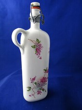 Bouillote ou bouteille en porcelaine, avec son sac, decor fleurie