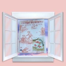 LIVRE ROUGE ET BLANC AU POINT