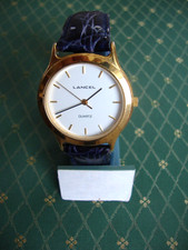 1 Montre homme -LANCEL- plaqué or à quartz bracelet cuir bleu façon croco