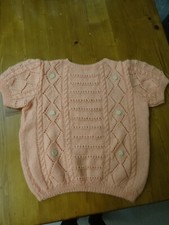 Pull rose à manches courtes