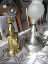 2   Lampes à essence   (Type lampe  Pigeon )  marque OLYMPE et l autre en etain