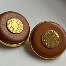 Rare Boucles d’oreilles Hermès clip cuir clou de selle vintage années 1980