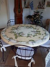 Table ronde en céramique pour véranda  et 8 chaises .