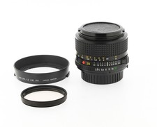 Objectif Minolta MD 28mm f/2.8 – avec bouchons, pare-soleil et filtre UV