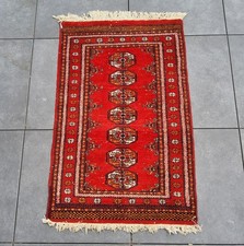 Tapis artisanal en laine fait