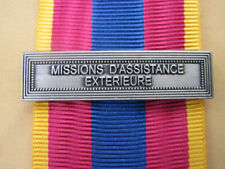 Agrafe  MISSIONS D'ASSISTANCE  EXTERIEURE  pour la Médaille Défense Nationale