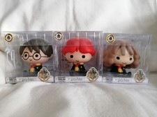 3 figurines tirelires neuves