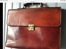 Serviette LANCEL cuir brun roux en bon état. ( N/ ) D