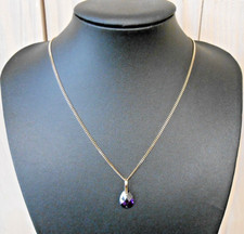 Pendentif  en or 18K  sertie d une amèthyste  poincon 750