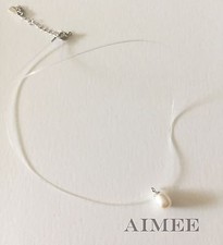 Collier femme en fil nylon transparent et pendentif perle