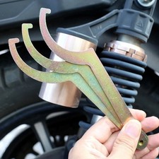 Clé de réglage à ressort