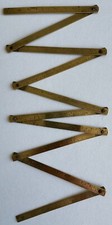 Ancien mètre gradué pliable en bronze Bon état