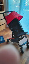 poussette bébé, couleur rouge et noir. Etat neuf. pliante dans sa housse facile 