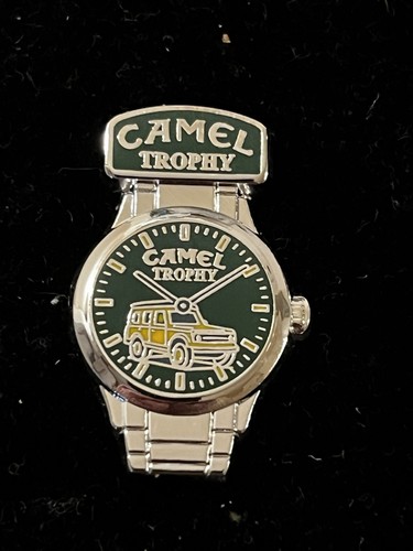 Pin montres camel trophy - pin’s,