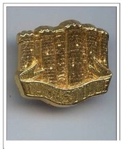 fève métal doré -