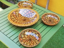 Grand plat a couscous et trois petits plats de service  en terre cuite émaillée