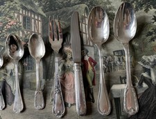 7 couverts Saint- Médard en métal argenté style rocaille 