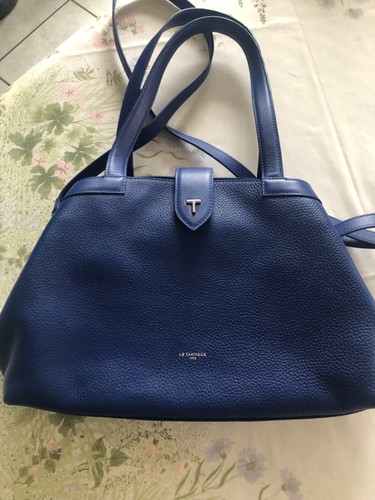 Sac tanneur porté - mains, ou