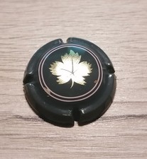 Capsule de vin pétillant générique grise avec feuille de vigne or