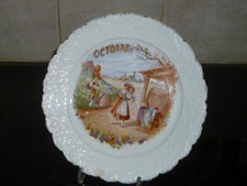 ANCIENNE ASSIETTE EN PORCELAINE MOULIN DES LOUPS HAMAGE MOIS OCTOBRE 21,5 CM