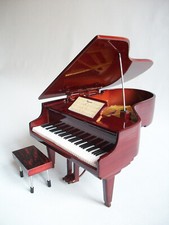 Piano queue miniature - à,