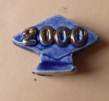 Fève pub perso du MH 2000 - Pâtisserie Costa à Monaco 