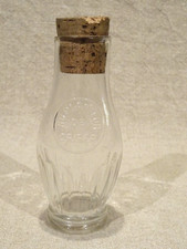 Ancien bocal  flacon  bouteille en verre Au planteur de Caiffa