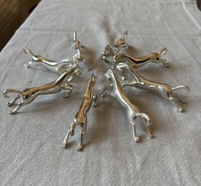 ENSEMBLE DE 8 PORTE-COUTEAUX EN METAL ARGENTE MODELE CHEVAUX