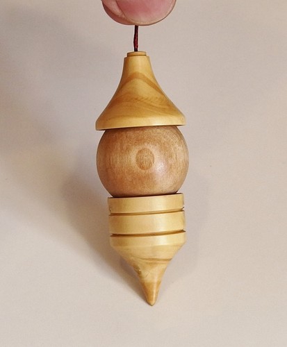 Pendule buis avec sphere en - buis,