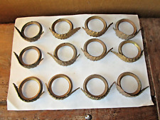 Lot d'une douzaine d'anneaux à rideaux anciens en laiton