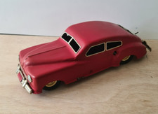 Voiture ancienne en tôle" AUTO TRIX"  mécanique  type coupé rouge avec frein 