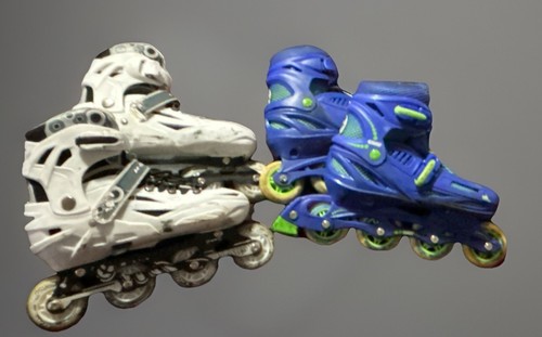 Two pairs used rollerblades - two,