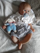 bébé reborn souriant Adam