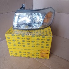 Phare gauche (fond chromé) Ford Transit 2000-2006