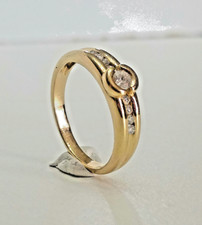 Belle bague femme 9 diamants d'occasion joaillerie or jaune 18 carats doigt 53