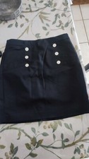 Jupe courte tailleur bouton