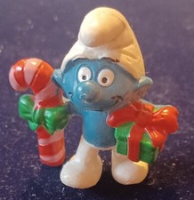 Figurine Schtroumpf Cadeau et sucre d'orge. Occasion