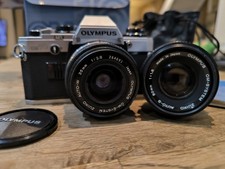 Olympus OM10 + F. Zuiko 50mm 1.8 + 35 Mm 1:2.8 + Boîte + Notice. Très Bon État.