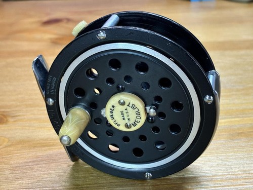 Moulinet mouche pflueger - à,
