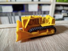 Bulldozer caterpillar jaune