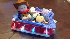 Newborn sleeping Cowgirl Baby