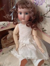 Poupée tête porcelaine