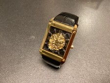 Montre festina peu servi en plaqué or cadran 4,5 cm x 3 cm bracelet cuir, 100 gr