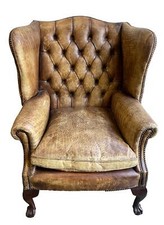 FAUTEUIL À OREILLES EN CUIR