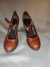 Chaussures escarpins babies à talon bride marron cuir motifs ajourés Minelli 39