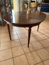 table ronde en acajou avec bandeau laiton  avec 2 rallonges de 45 cm