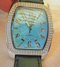 Mtr TONNEAU SUISSE A RUBIS VILY ,LUNETTE SERTI DE SWAROVSKI , DATE,TB FONCTIONS