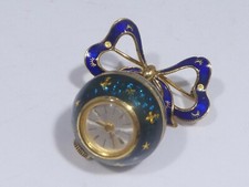 14K GOLD AND ENAMEL BOW W AN ENAMEL RITMA BALL CLOCK WORKING